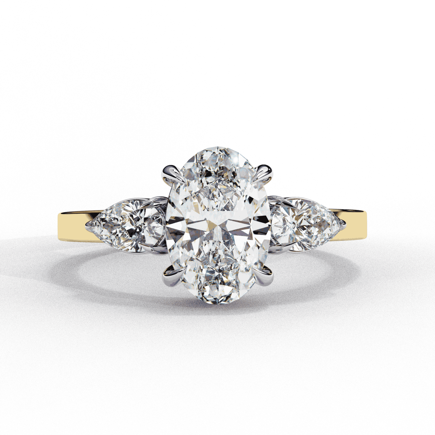 Oval Cut Lab Grown Diamond Three Stone Engagement Ring with Pear Side Accents