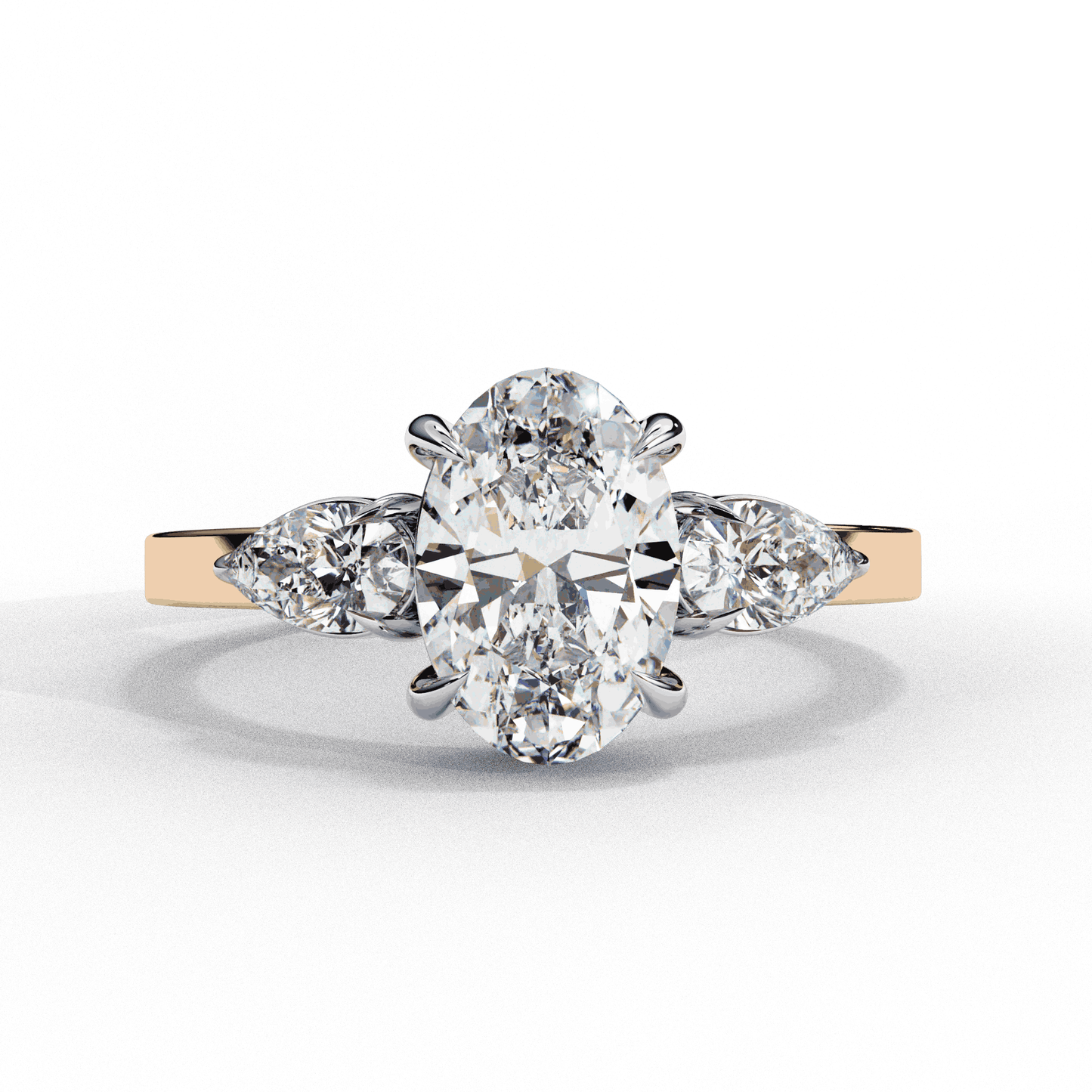 Oval Cut Lab Grown Diamond Three Stone Engagement Ring with Pear Side Accents
