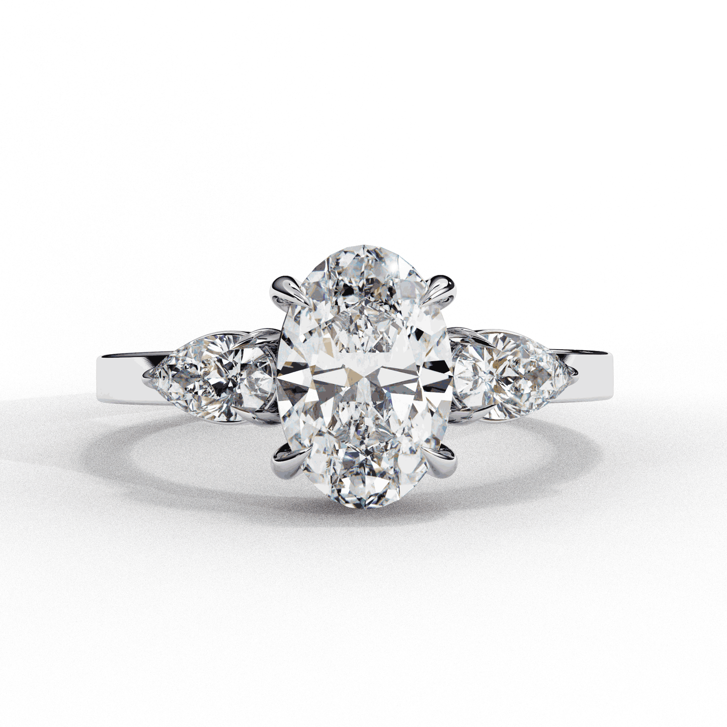 Oval Cut Lab Grown Diamond Three Stone Engagement Ring with Pear Side Accents