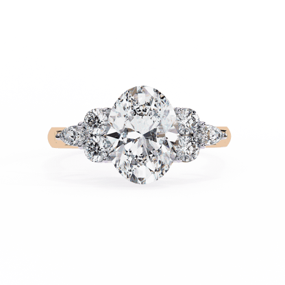 Oval Cut Lab Grown Diamond Side Stone Engagement Ring with Round and Pear Cluster Accents